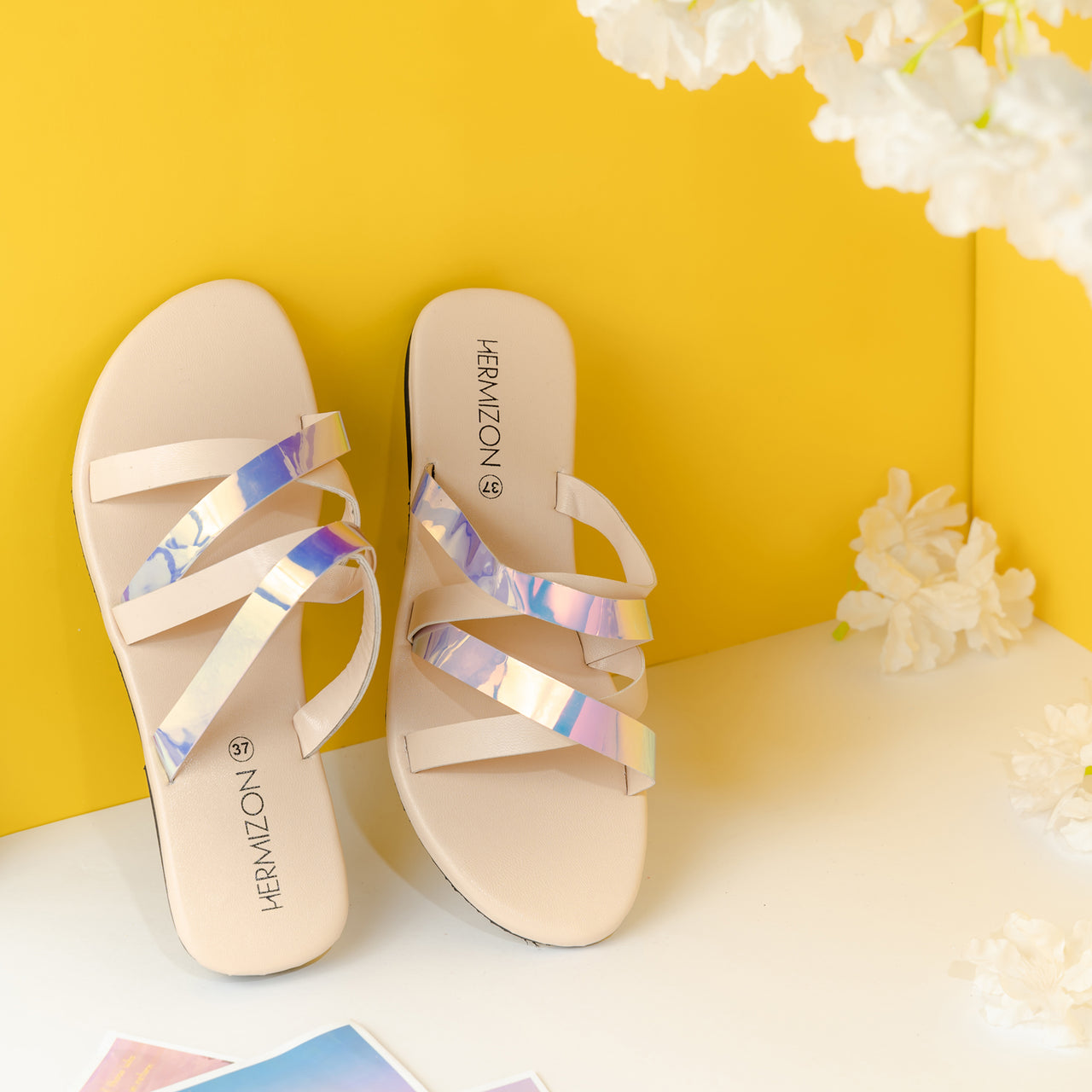 A off white color sandal with gradient strips.