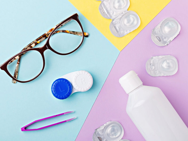 Different types of eye care products such as sunglasses, contact lenses, solution and twiser. 