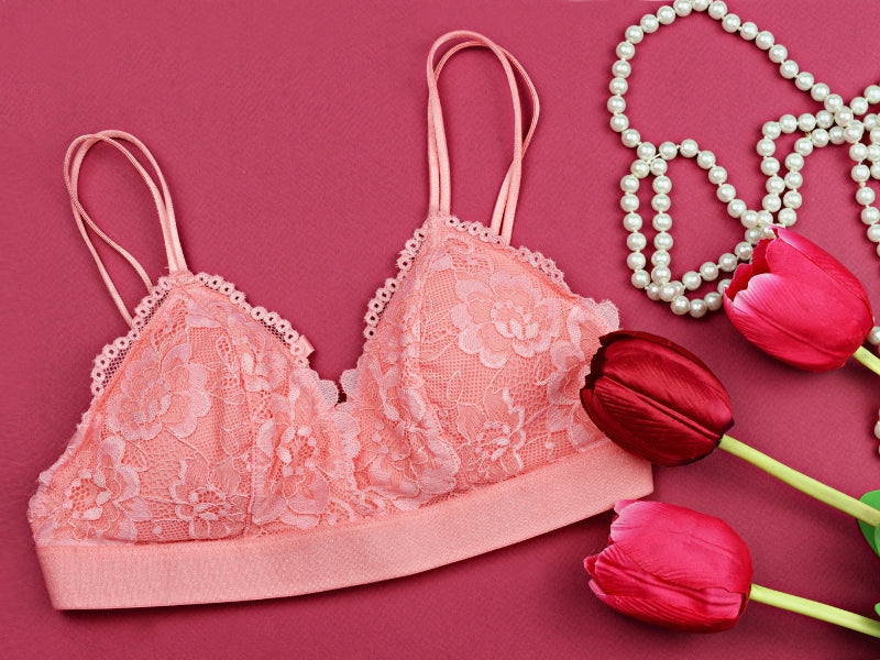A category picture for lingerie including a bra, rose and pearl jewelry.