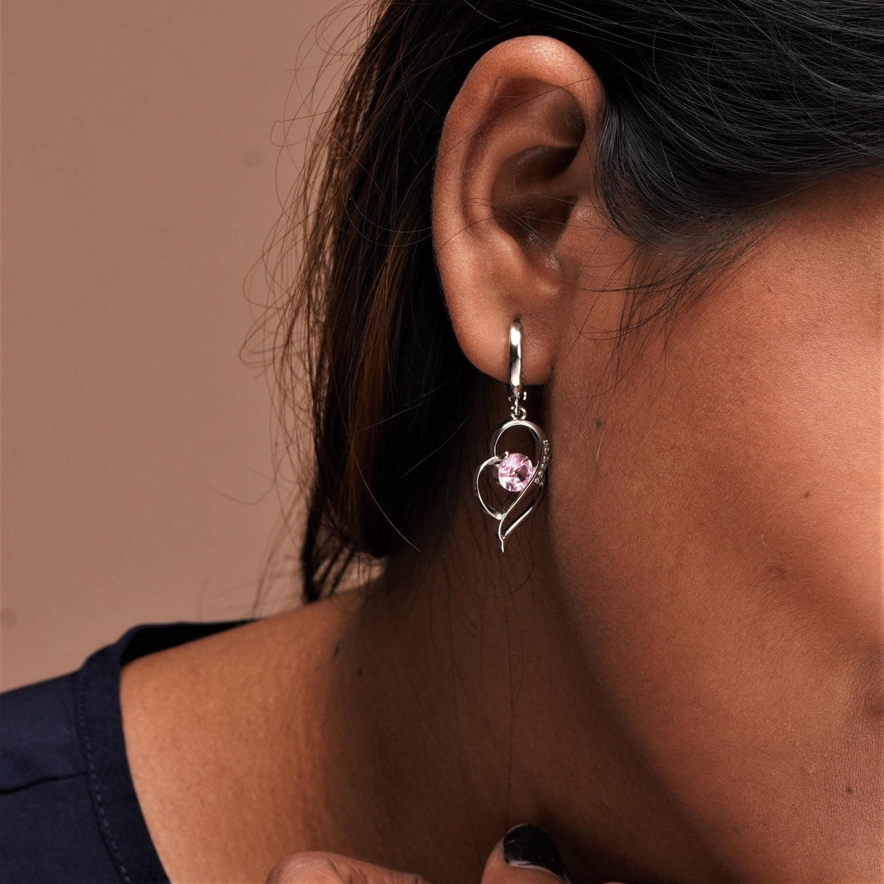 Silver color metal with a pink color stone earrings