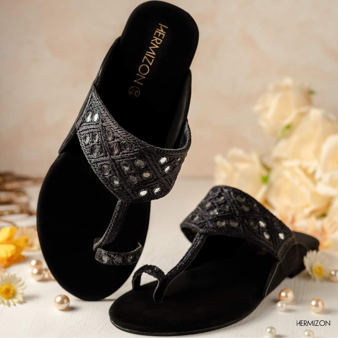 A black color flat sandals from Hermizon brand.