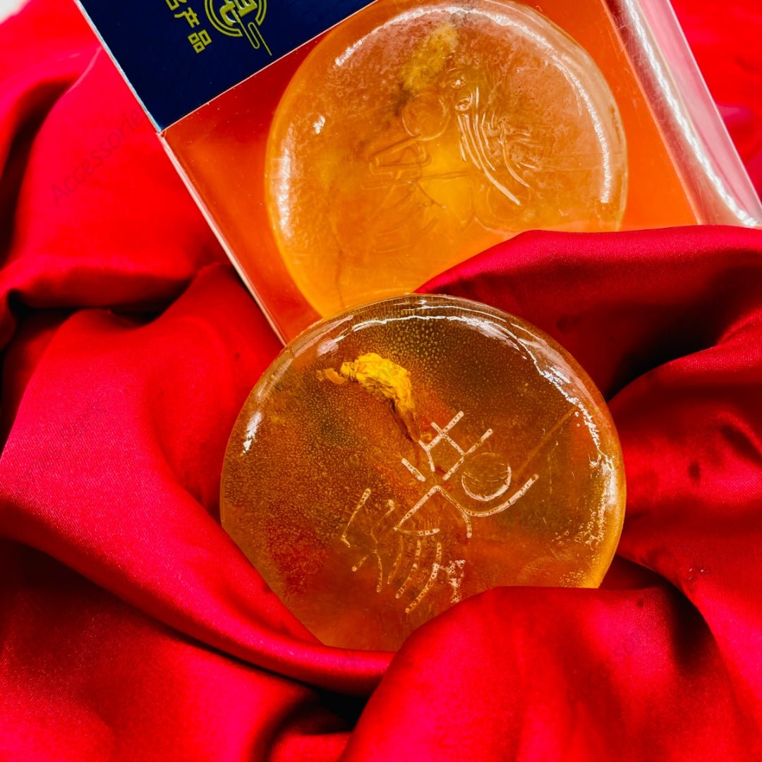 A real picture of handmade ginseng soap on red fabric