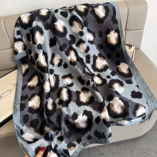 Leopard print blanket draped over a chair