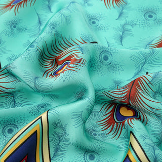 Close-up of a colorful fabric with abstract patterns on a teal background