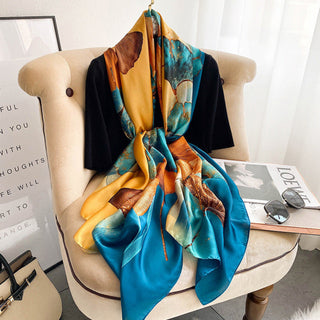 Colorful scarf draped over a chair in a room with decor elements.