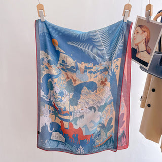 Colorful scarf with animal pattern hanging on a white background