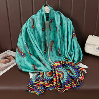 Colorful scarf with peacock feather pattern on a brown surface