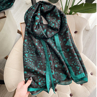 Patterned scarf draped over a chair with a blurred indoor background
