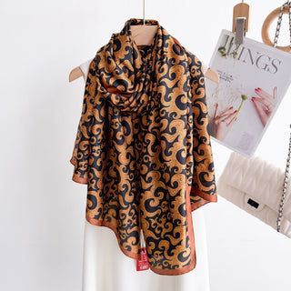 Patterned scarf on a mannequin with a magazine in the background