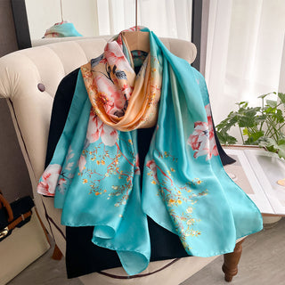 Floral patterned scarf draped over a chair with a blurred indoor background