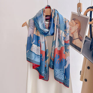 Colorful scarf with artistic design on a mannequin against a white background