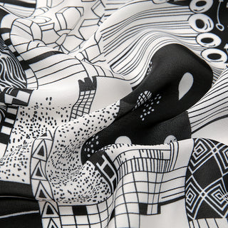 Black and white patterned fabric with abstract designs