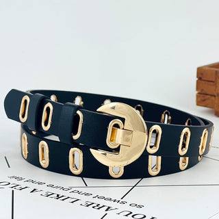 Black leather belt with gold半月 buckle on a newspaper background