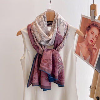 Floral patterned scarf draped over a mannequin with a photo of a woman in the background.